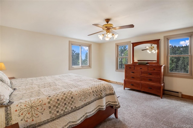 688 Obsidian Dr, Florissant, CO 80816 - bedroom featuring baseboards, a baseboard radiator, carpet, and a ceiling fan