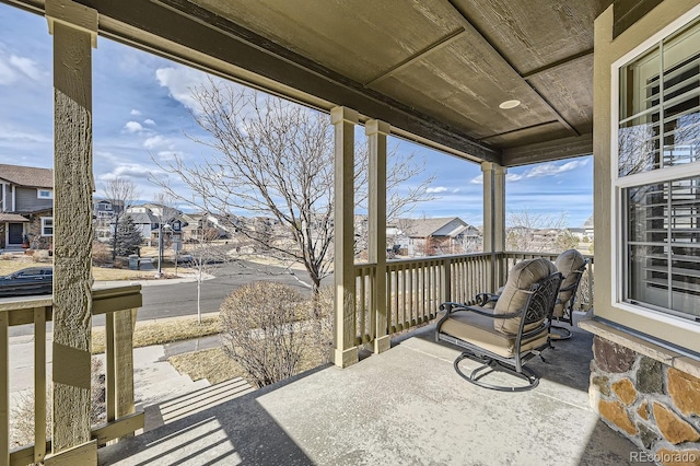 exterior space featuring a residential view and covered porch