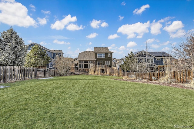 view of yard with a fenced backyard