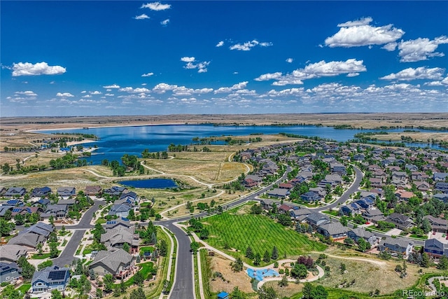 drone / aerial view with a residential view and a water view