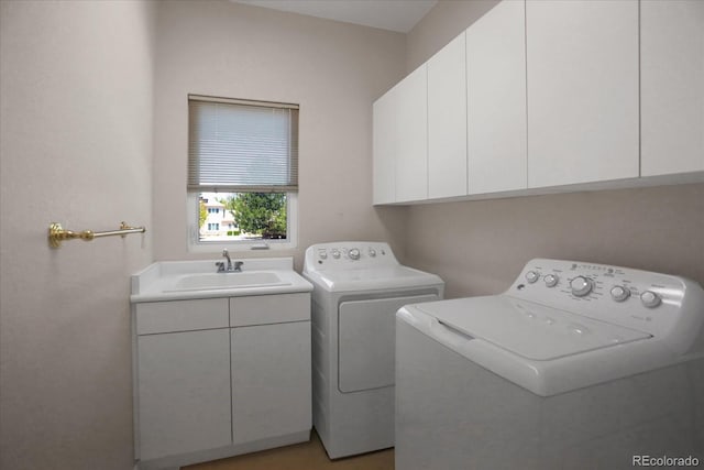 laundry room featuring cabinet space and washing machine and dryer