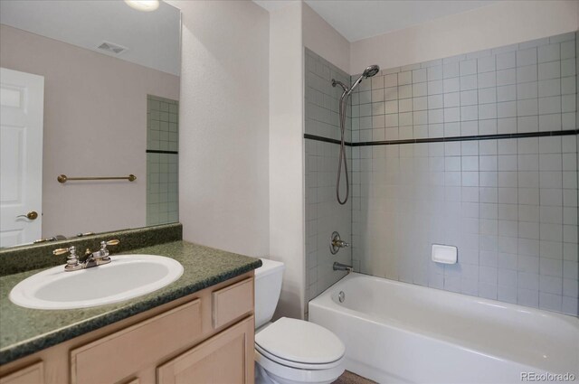 bathroom featuring toilet, washtub / shower combination, and vanity