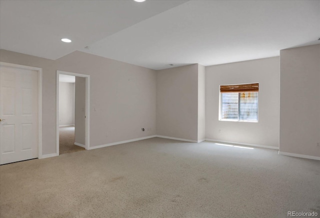 carpeted empty room featuring baseboards and recessed lighting