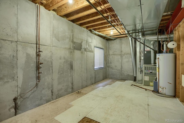 basement featuring water heater and heating unit