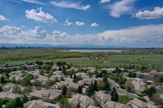 aerial perspective of suburban area with a nearby body of water