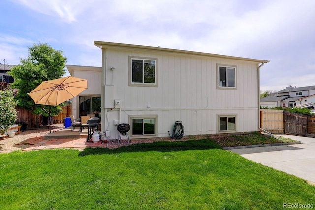 back of house with a patio