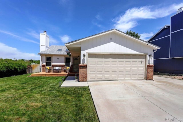 ranch-style home featuring brick siding, a front lawn, driveway, an attached garage, and a chimney