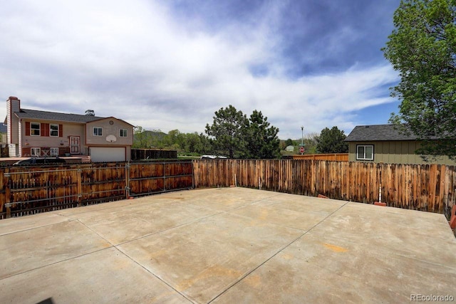 view of patio / terrace featuring fence