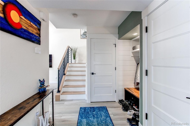 mudroom with wood finish floors