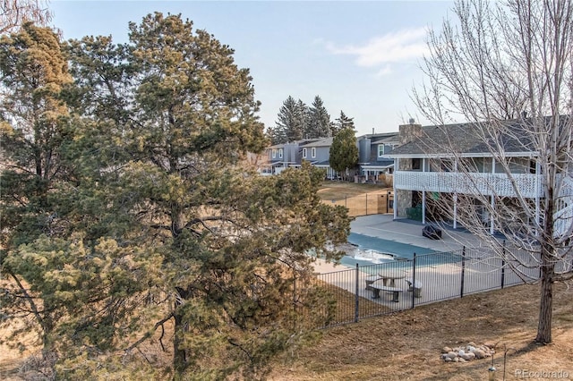 exterior space featuring a patio area, a sunroom, and fence