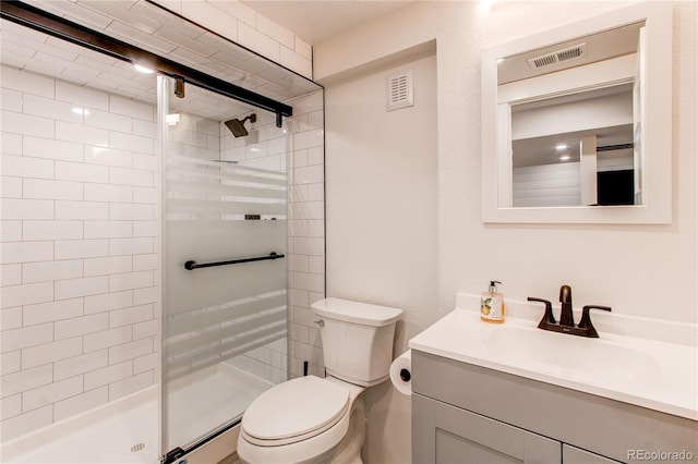 full bathroom featuring visible vents, a shower stall, and toilet