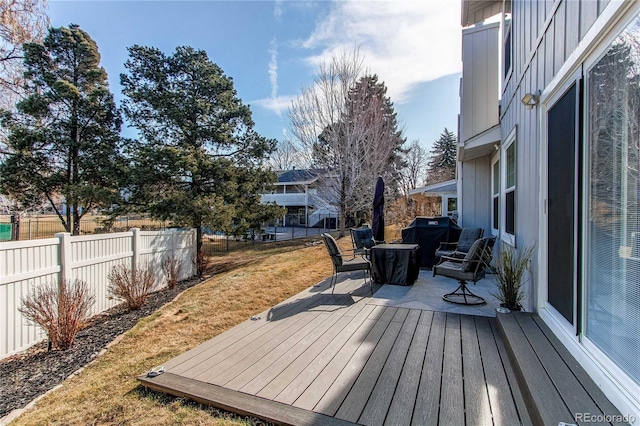 wooden deck featuring fence