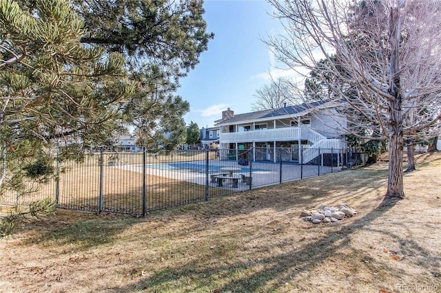 exterior space featuring stairs, a patio, and fence