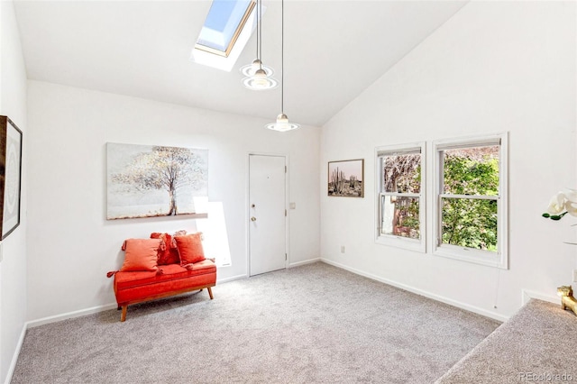 sitting room with carpet floors, a skylight, baseboards, and high vaulted ceiling