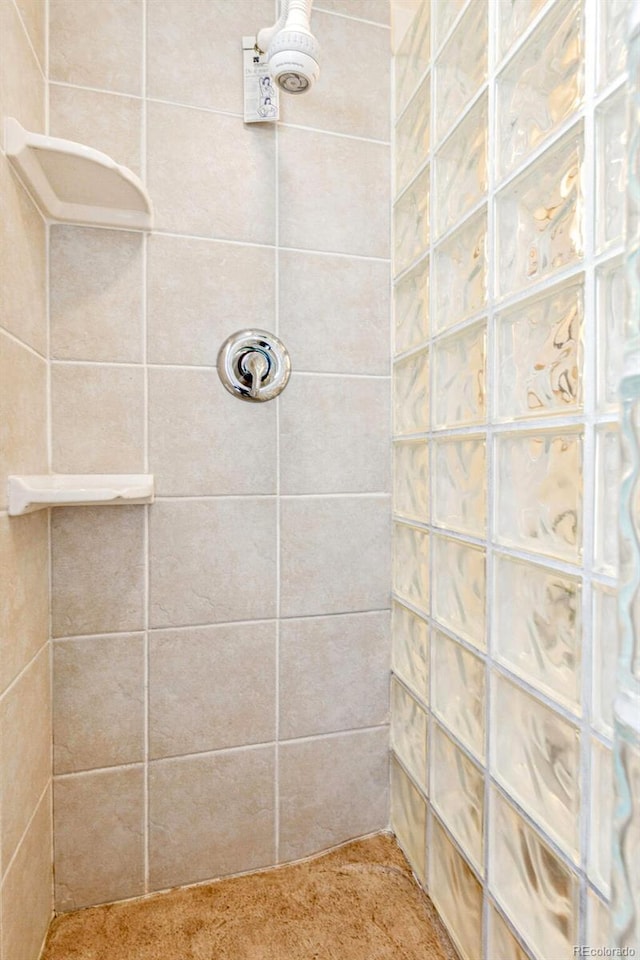 full bath featuring a tile shower