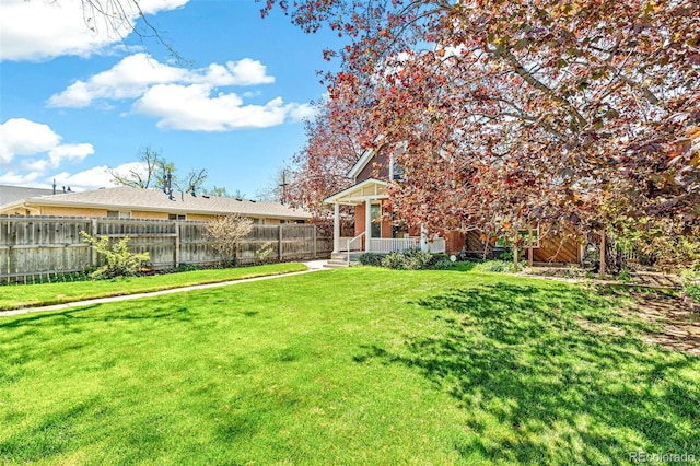 view of yard featuring fence