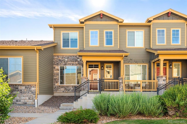 5562 W 72nd Pl, Westminster, CO 80003 - view of front facade featuring stone siding and board and batten siding