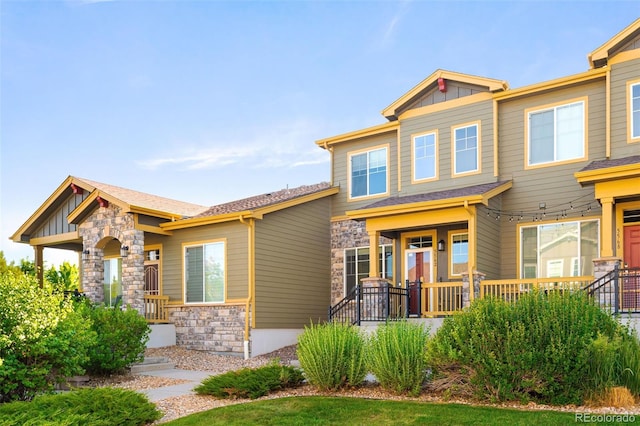 5562 W 72nd Pl, Westminster, CO 80003 - craftsman house with stone siding, a porch, and board and batten siding