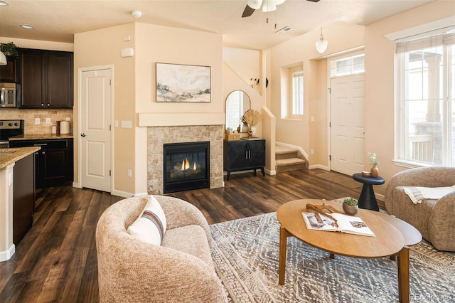 5562 W 72nd Pl, Westminster, CO 80003 - living room with a ceiling fan, dark wood-type flooring, stairs, a tiled fireplace, and recessed lighting