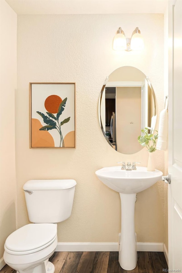 5562 W 72nd Pl, Westminster, CO 80003 - half bath with toilet and wood finished floors