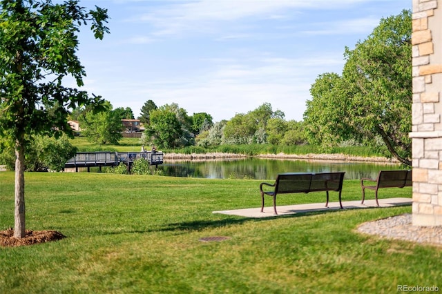 5562 W 72nd Pl, Westminster, CO 80003 - surrounding community featuring a water view and a lawn