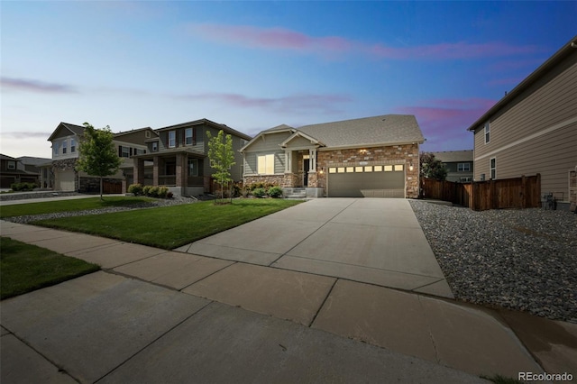 1261 W 170th Ave, Broomfield, CO 80023 - view of front facade with an attached garage, driveway, and stone siding