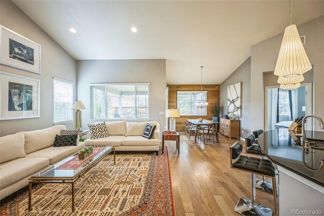 1261 W 170th Ave, Broomfield, CO 80023 - living room with vaulted ceiling, light wood finished floors, and recessed lighting