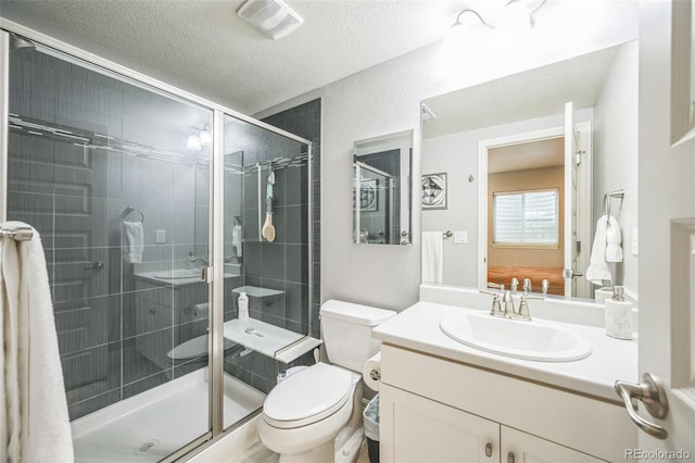 1261 W 170th Ave, Broomfield, CO 80023 - full bathroom featuring vanity, a shower stall, and a textured ceiling