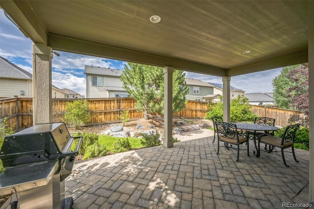 1261 W 170th Ave, Broomfield, CO 80023 - fenced backyard with a patio, outdoor dining area, a grill, and a residential view