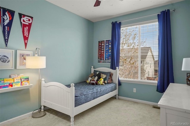 15960 W 62nd Dr, Arvada, CO 80403 - carpeted bedroom featuring multiple windows, baseboards, and a ceiling fan