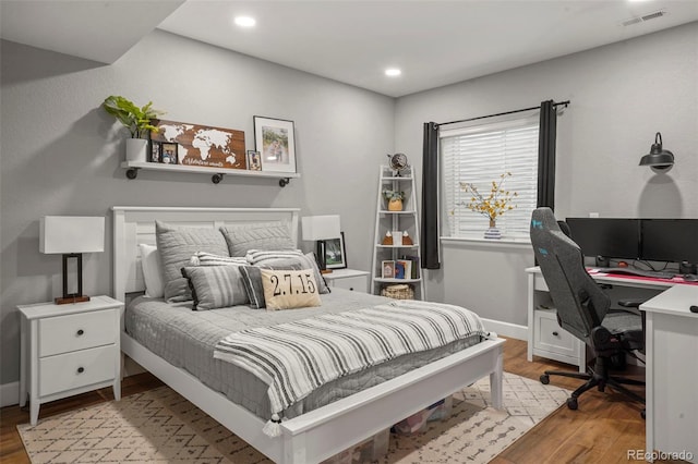 15960 W 62nd Dr, Arvada, CO 80403 - bedroom featuring recessed lighting, baseboards, visible vents, and light wood-style floors