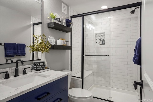 15960 W 62nd Dr, Arvada, CO 80403 - bathroom with vanity, toilet, and a shower stall