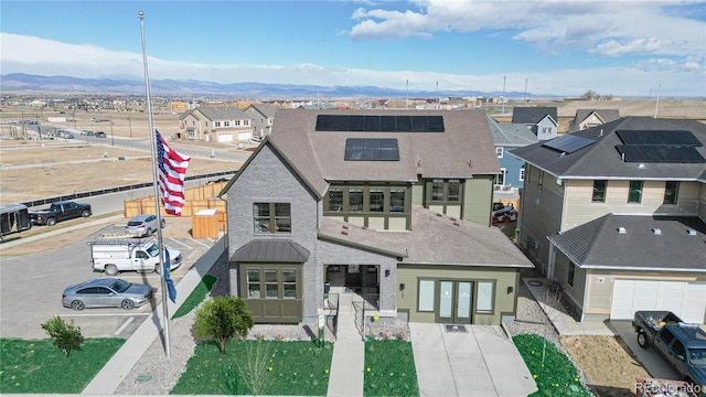 view of front of house with a mountain view and french doors