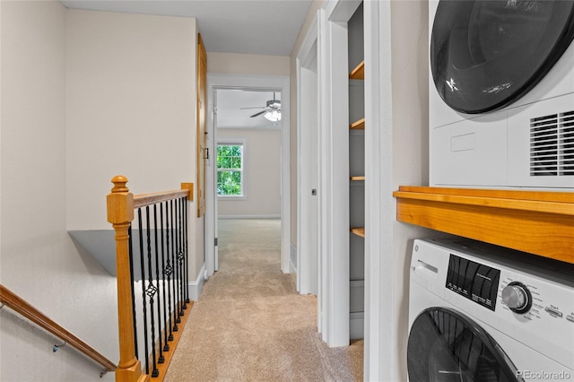 10814 Bayfield Way, Parker, CO 80138 - laundry area with carpet flooring, a ceiling fan, and stacked washer / dryer