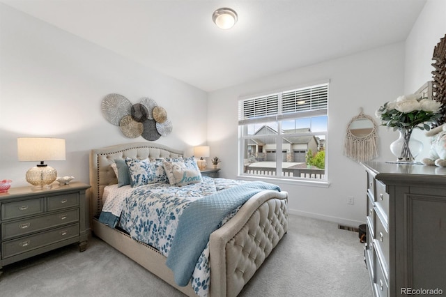 bedroom with light colored carpet