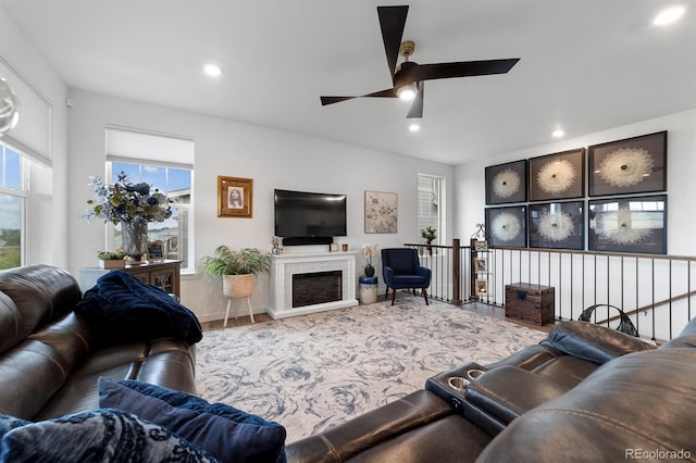 living room featuring hardwood / wood-style floors and ceiling fan