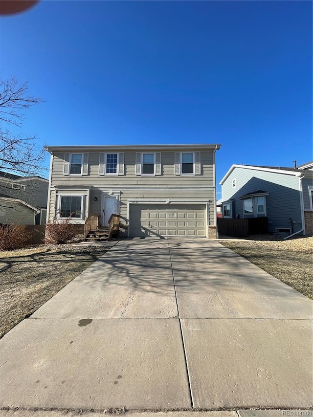 view of front of property with a garage