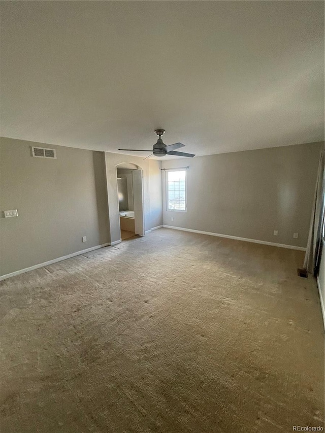 carpeted empty room with ceiling fan