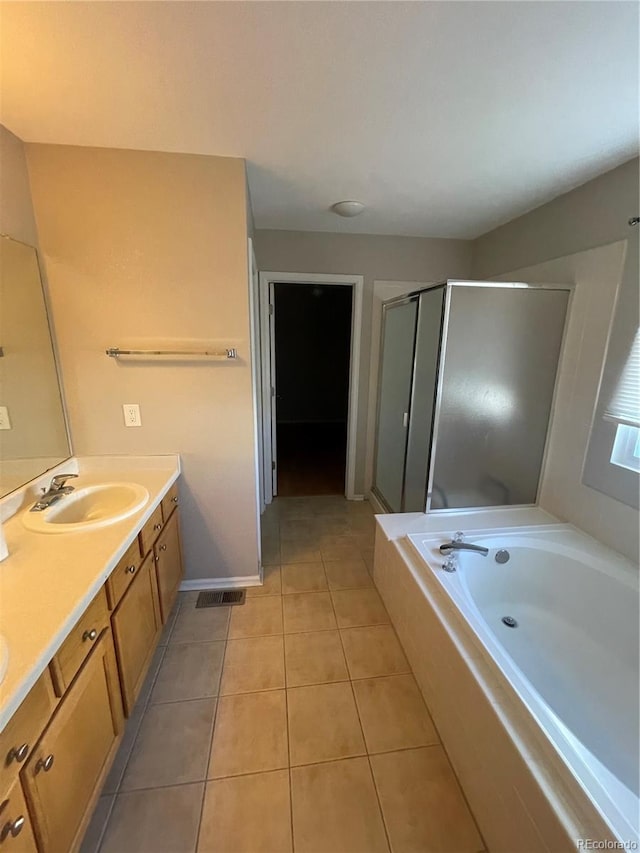 bathroom featuring shower with separate bathtub, tile flooring, and vanity