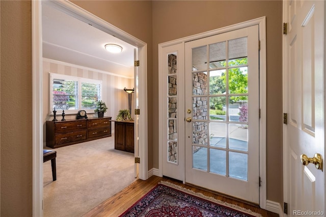 9 Roder Gate Ln, Castle Pines, CO 80108 - entryway featuring ornamental molding, light wood-style flooring, and baseboards