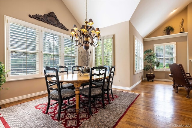 9 Roder Gate Ln, Castle Pines, CO 80108 - dining space featuring vaulted ceiling, a chandelier, wood finished floors, and baseboards