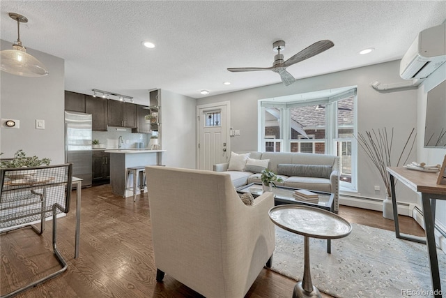 1355 Gaylord St Unit 6, Denver, CO 80206 - living room with a ceiling fan, dark wood finished floors, an AC wall unit, a textured ceiling, and healthy amount of natural light