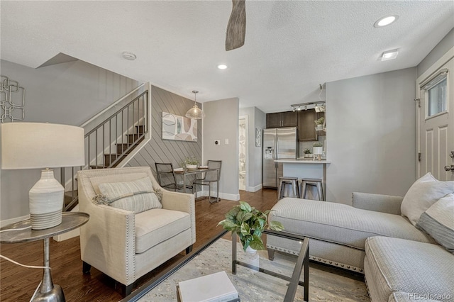 1355 Gaylord St Unit 6, Denver, CO 80206 - living area with dark wood-style flooring, baseboards, a ceiling fan, stairway, and a textured ceiling