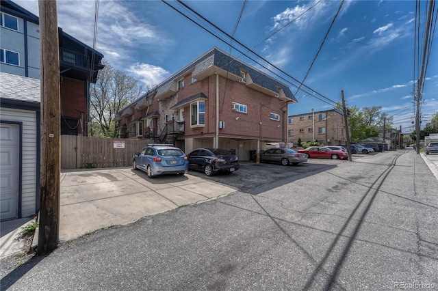 1355 Gaylord St Unit 6, Denver, CO 80206 - uncovered parking lot featuring fence and a residential view
