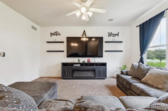 178 Blue Bonnet Dr, Brighton, CO 80601 - carpeted living room with a ceiling fan