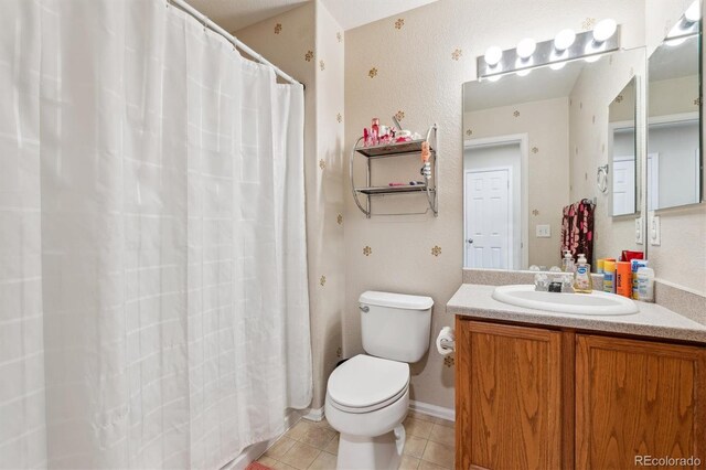 178 Blue Bonnet Dr, Brighton, CO 80601 - bathroom with tile patterned floors, vanity, toilet, and a shower with curtain