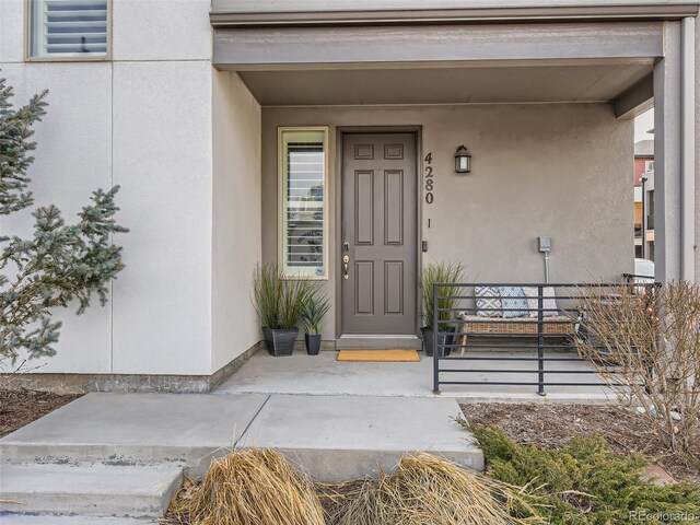 entrance to property with covered porch