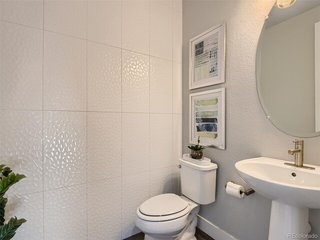 bathroom with toilet and sink