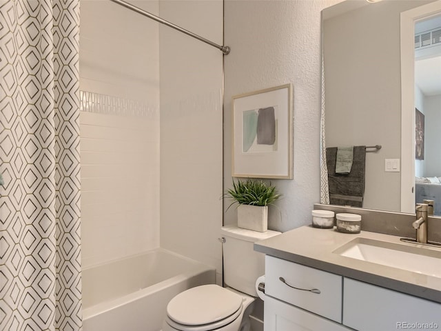 full bathroom with vanity, toilet, and shower / bath combo with shower curtain