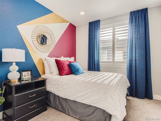 bedroom featuring light carpet